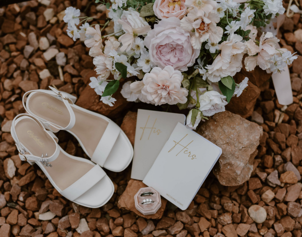 Wide shot of full flat lay featuring all bride and groom wedding day details
